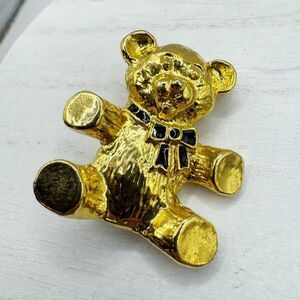 Vintage 80s black enamel bow teddy bear brooch in gold tone metal